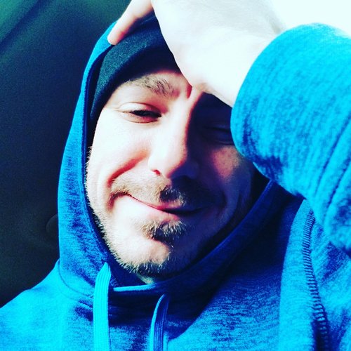 Chance Trahan Certified Life Coach wearing a blue adidas hoodie and black beanie skull cap.